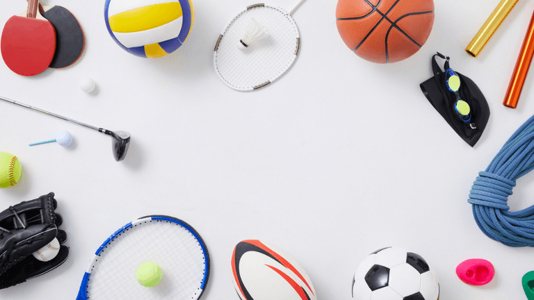 Sports equipment including basketball, soccer ball, tennis racket, baseball glove, and volleyball arranged on a white background.