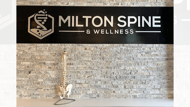 "Milton Spine & Wellness sign showcasing the clinic's holistic health services, including chiropractic care and Kangen Water®."