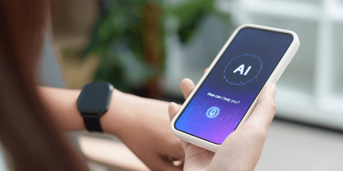 Person holding a smartphone displaying an AI assistant interface on the screen.