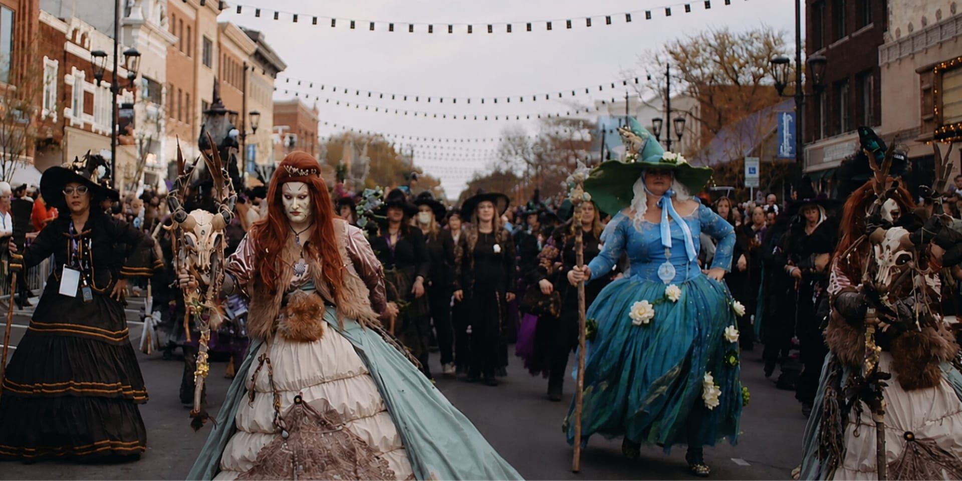 Elaborately dressed witches lead a downtown parade during Sandusky Witches Walk’s Halloween-themed anniversary event.
