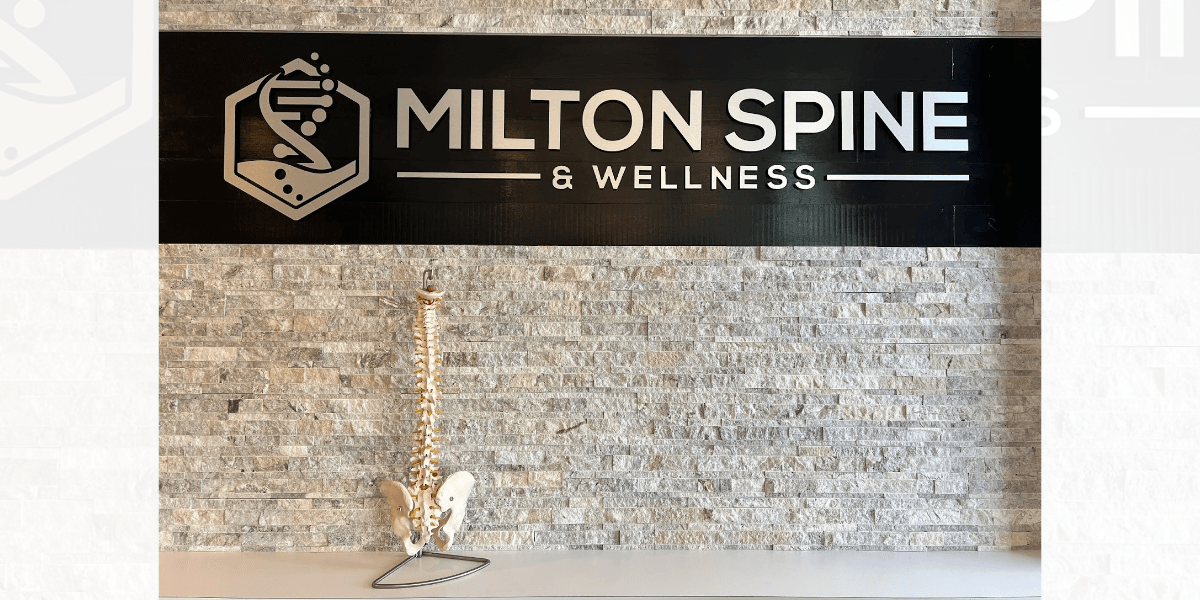 "Milton Spine & Wellness sign showcasing the clinic's holistic health services, including chiropractic care and Kangen Water®."